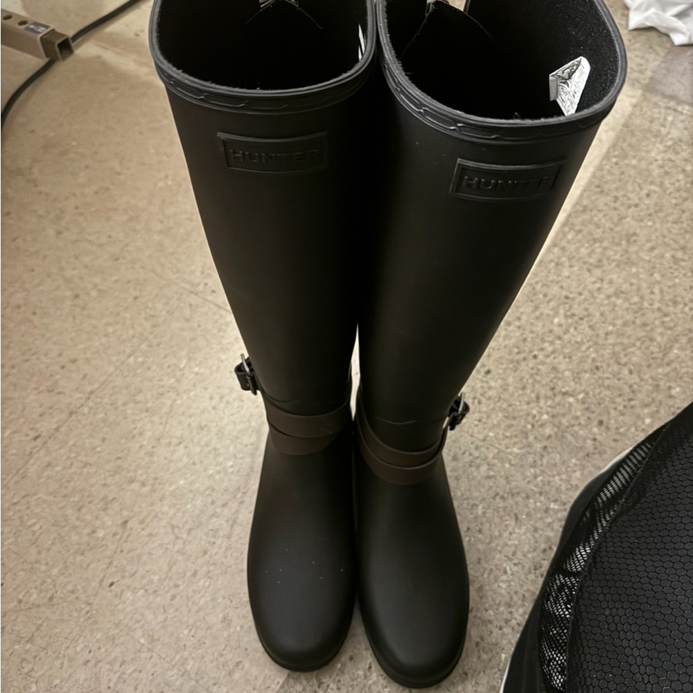 Matte black Hunter rain boots.